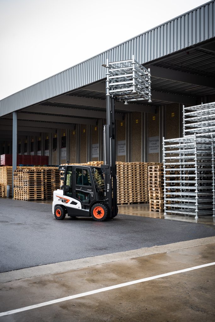 Doosan Bobcat 9-Series Diesel Forklift Truck with Fully Enclosed Cabin in Use