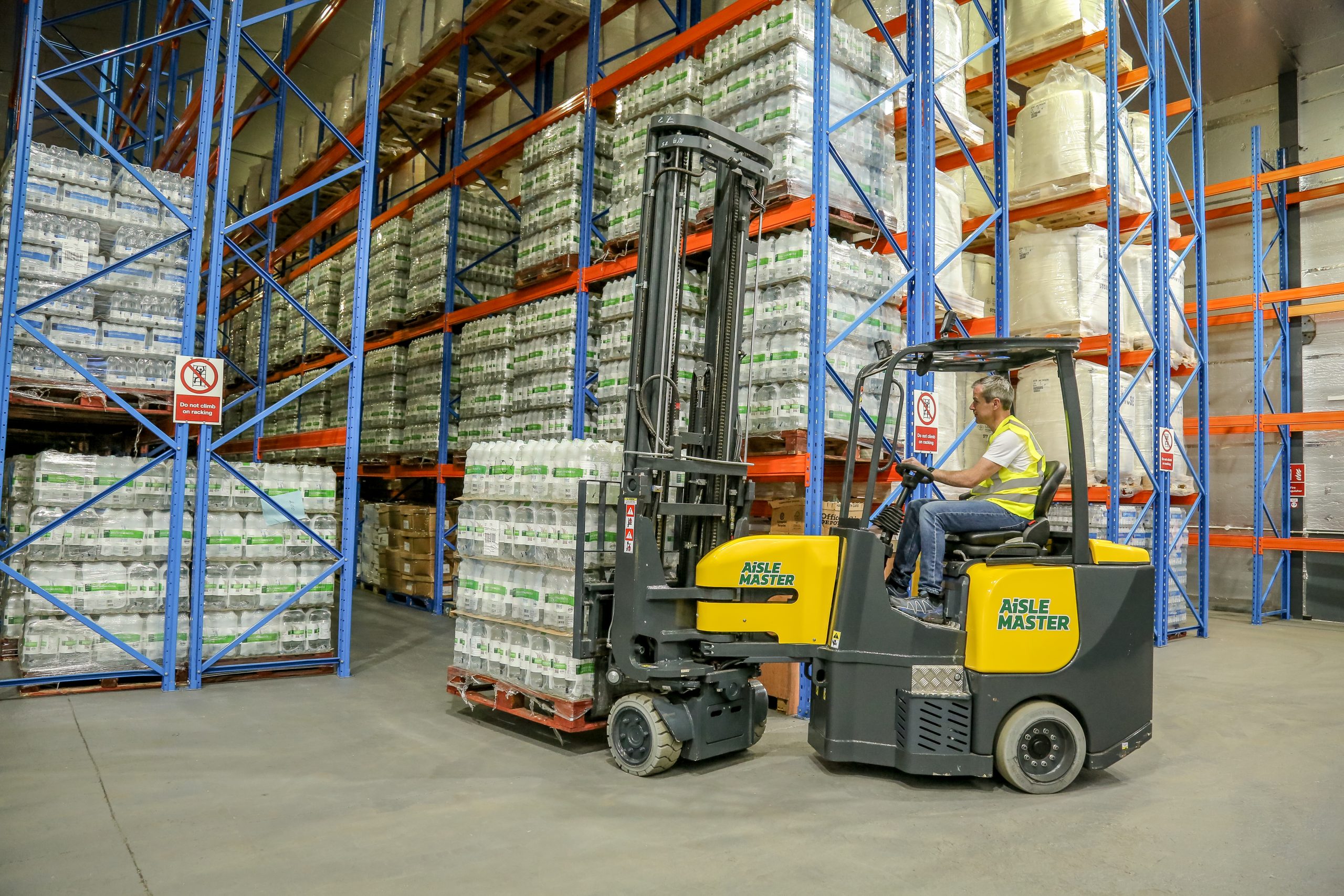 Articulated VNA Combilift Aislemaster Electric Forklift in use