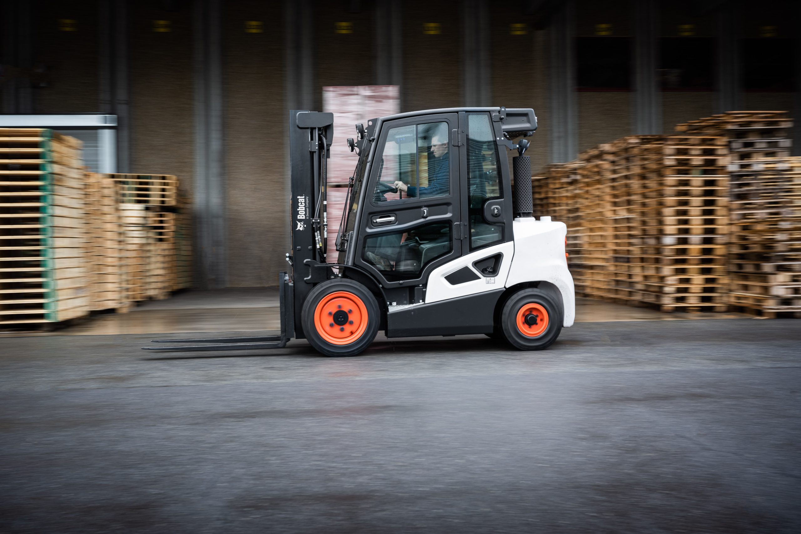 Doosan Bobcat 9-Series Diesel Forklift Truck with Fully Enclosed Cabin in Use Large